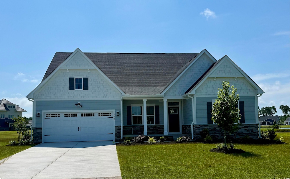 Craftsman-style house with a garage and a front yard