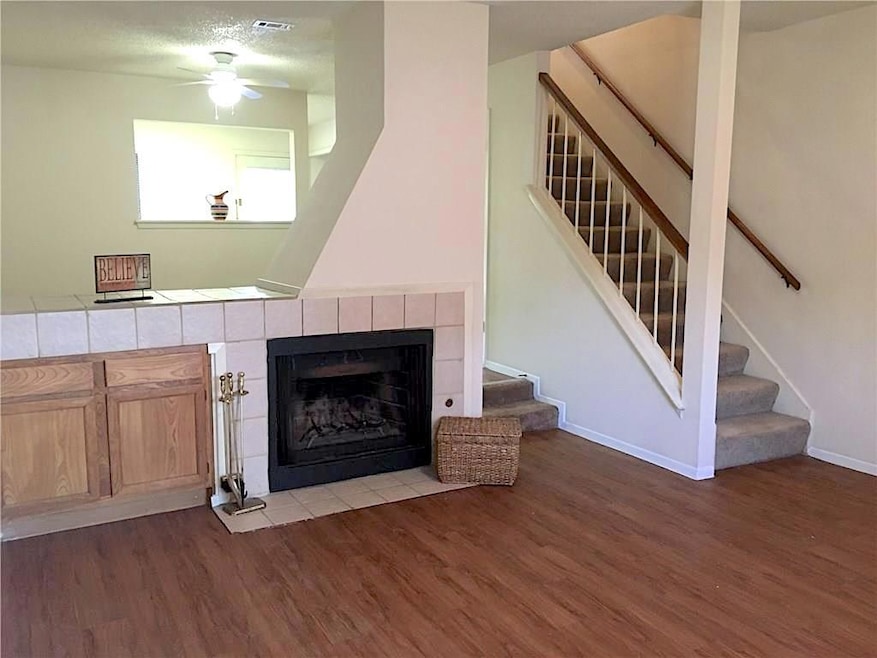Unfurnished living room featuring wood finished f