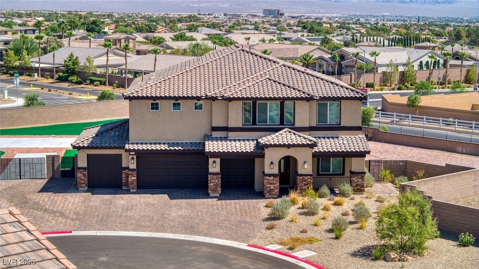 Mediterranean / spanish-style house with a tiled roof, stucco siding, decorative driveway, a residential view, and a garage