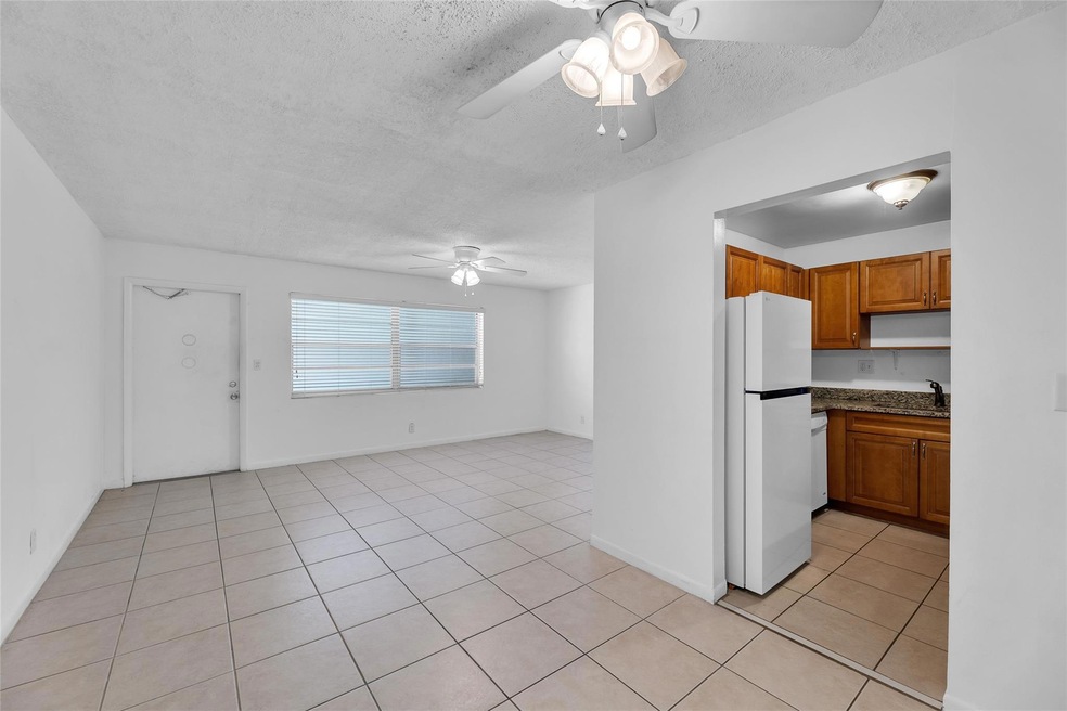 Spacious main living area with tile flooring