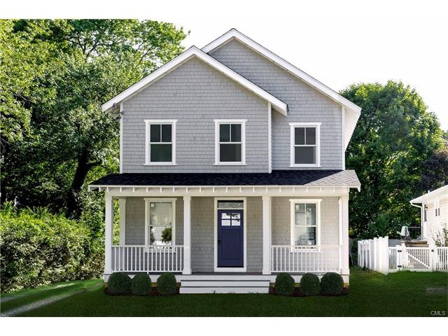 New construction farmhouse bathed in light enterin