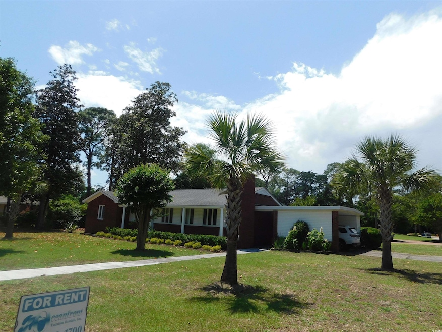 Single story home with a front yard