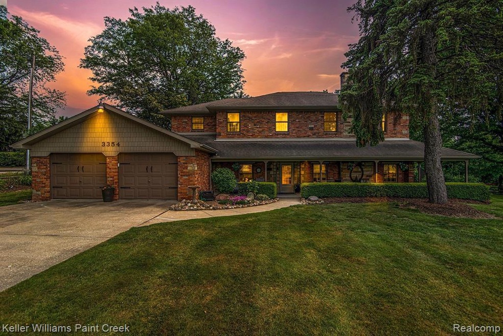 Nestled on a quiet, wooded lot on 1.72 acres.