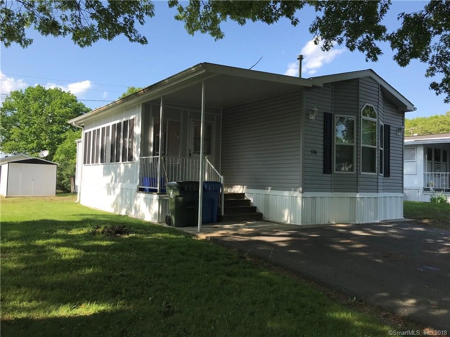 Home with enclosed porch.
