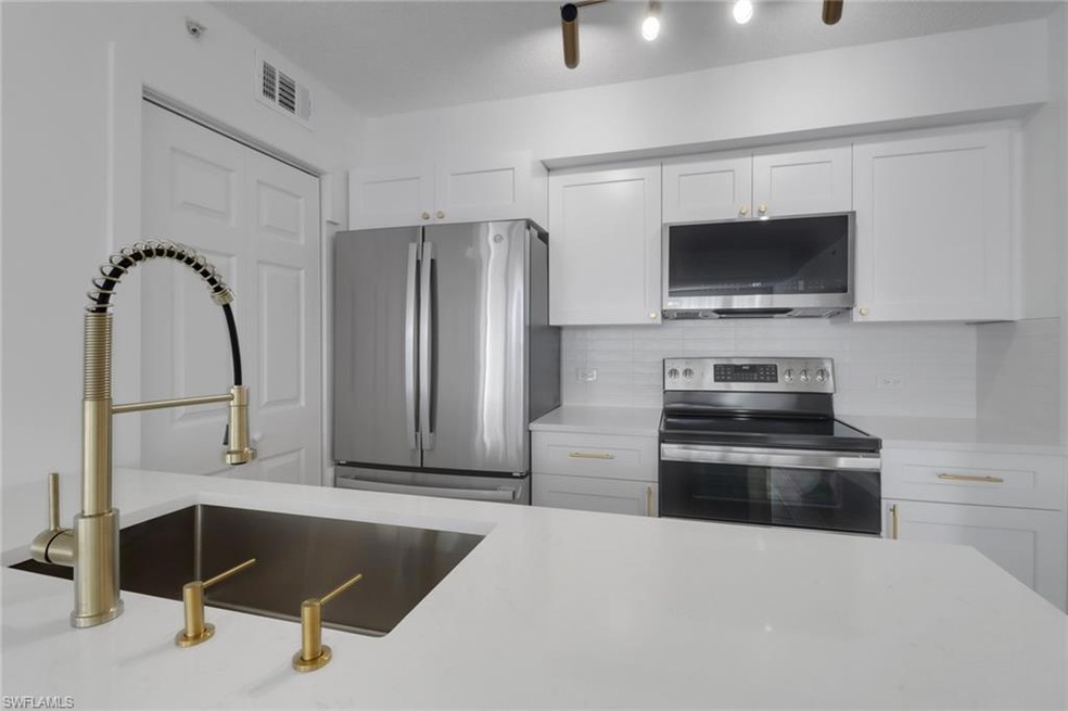 Kitchen featuring tasteful backsplash, a sink, lig