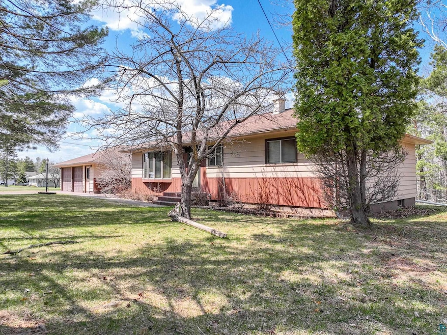 View of front of property with a front yard and a 