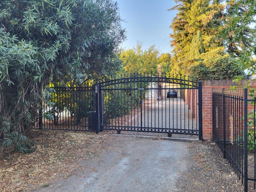 Wrought iron Fencing and Electronic Gate in Front 