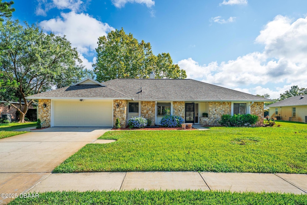 Exterior with Coquina Stone, block and stucco.