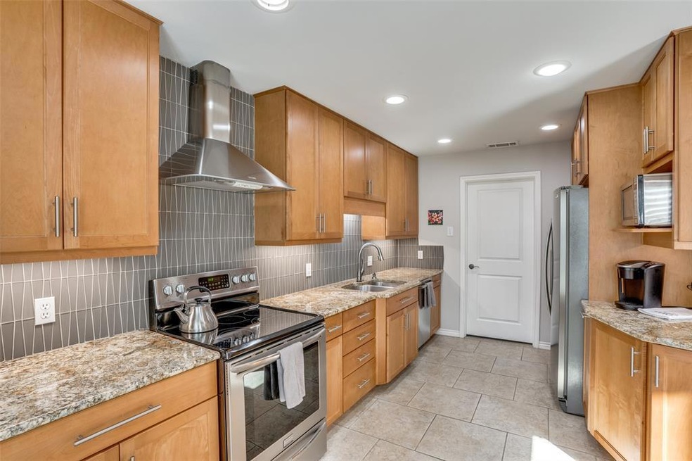Kitchen with beautiful grey designer backsplash an