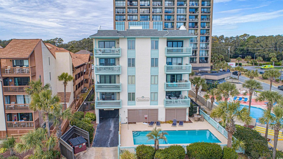 View of property featuring a community pool