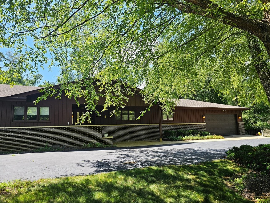 Sprawling Brick and Cedar Ranch on Half Acre lot