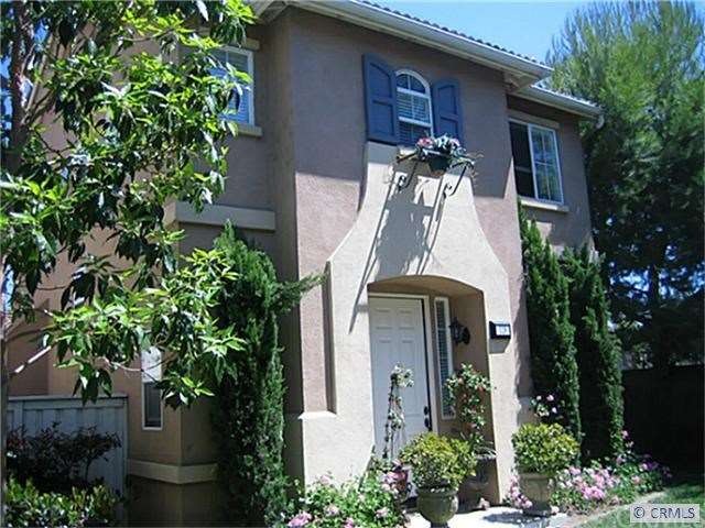 Front view of this detached home with 2 master sui