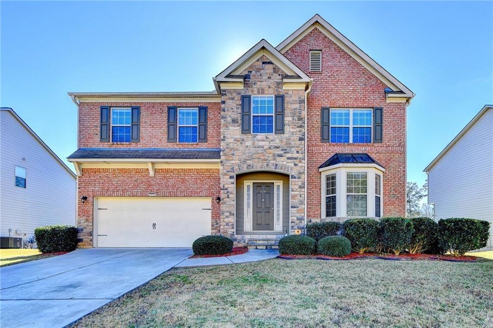 View of front of property featuring a garage and a