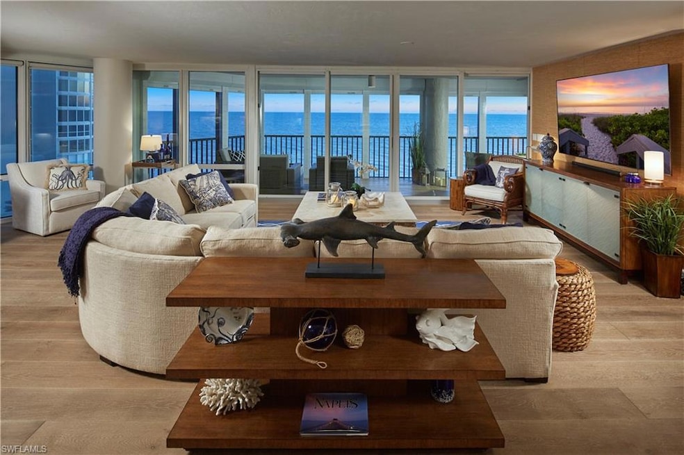 Living room featuring a wall of windows and light 