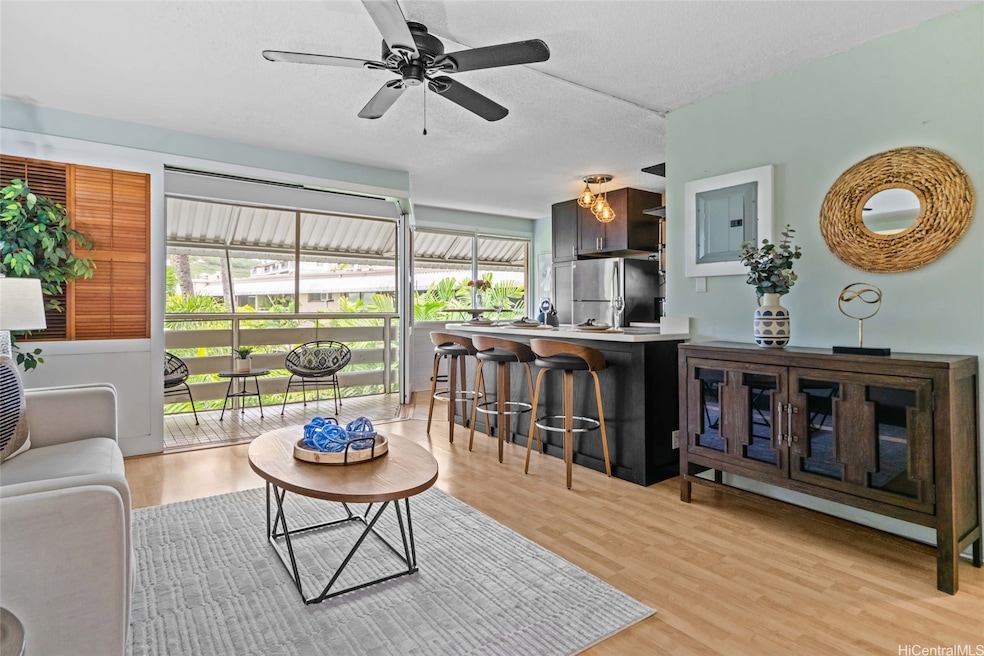 Open kitchen, living room, looking toward lanai. T