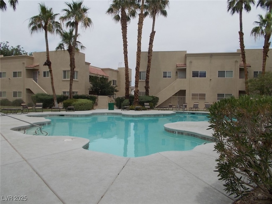 Community pool featuring a patio area