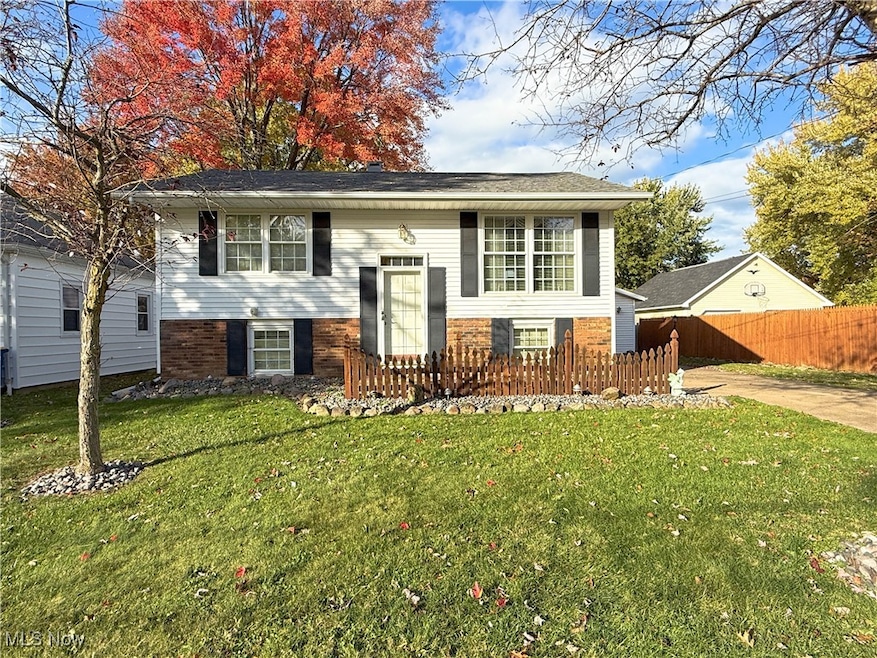 Split foyer home with brick siding
