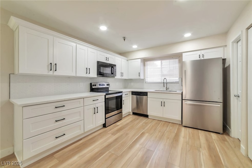 Kitchen featuring appliances with stainless steel