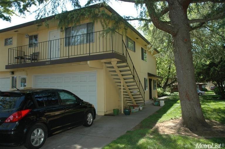 The condo shares a 2-car garage