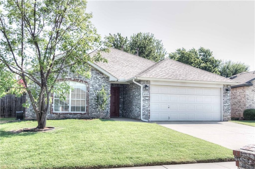 4009 Gyrfalcon Dr, Norman, OK 73072 - photo 1