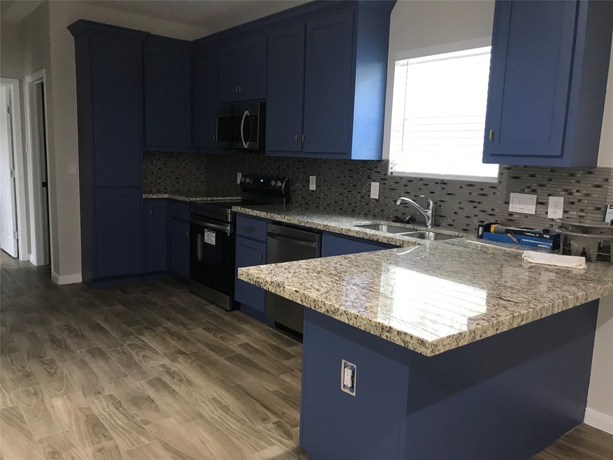 904 W Sealy St unit A, Alvin, TX 77511 - photo 1