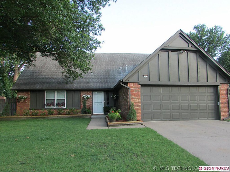 Front of home with recent exterior paint and fresh