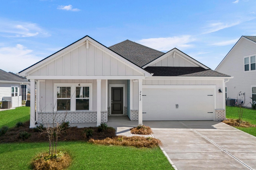 View of front of property featuring roof with shin