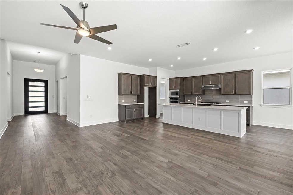 Kitchen with stainless steel appliances, light co