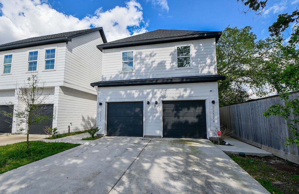 Spacious garage with extra parking for convenience
