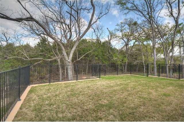 Located at the end of a pretty cul-de-sac nestled against Cowan Creek, the views are beautiful at both the front and back yards of this Sun City Texas Surrey Crest.