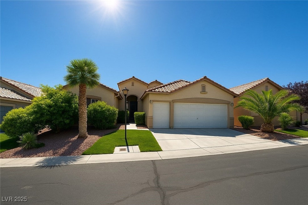 Mediterranean / spanish-style home with a garage,