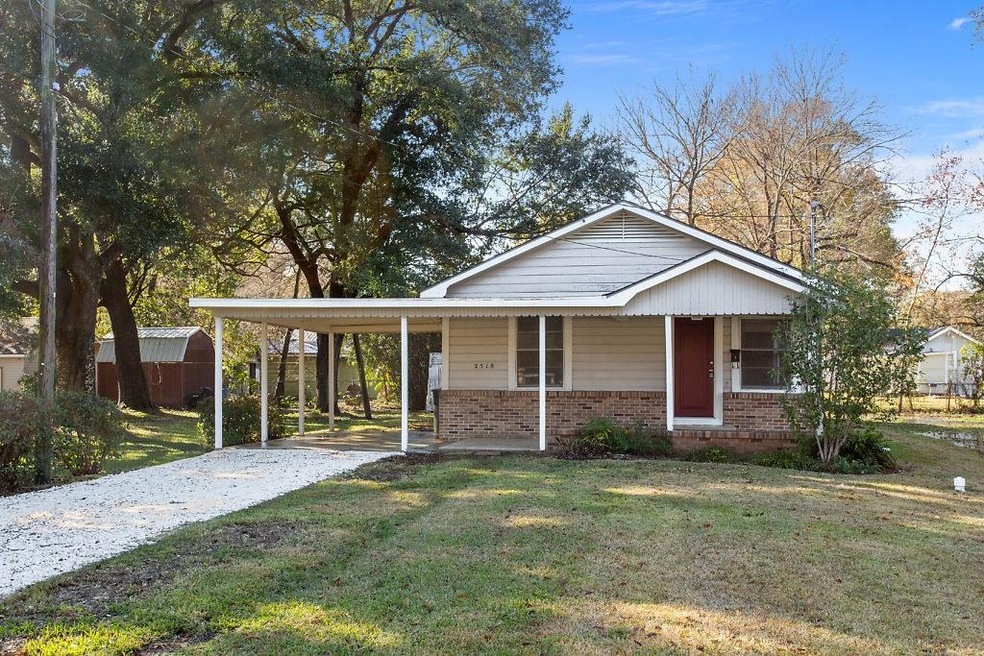 Front Exterior:  Well kept cottage.  Brick and woo