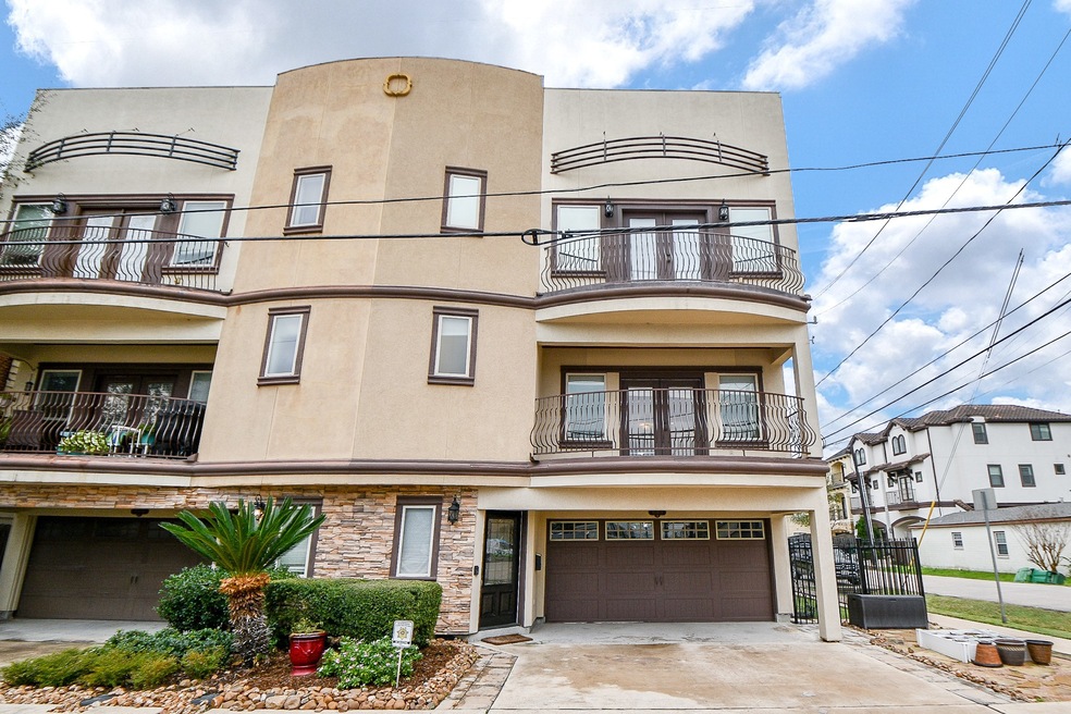 This is a modern, three-story townhouse featuring