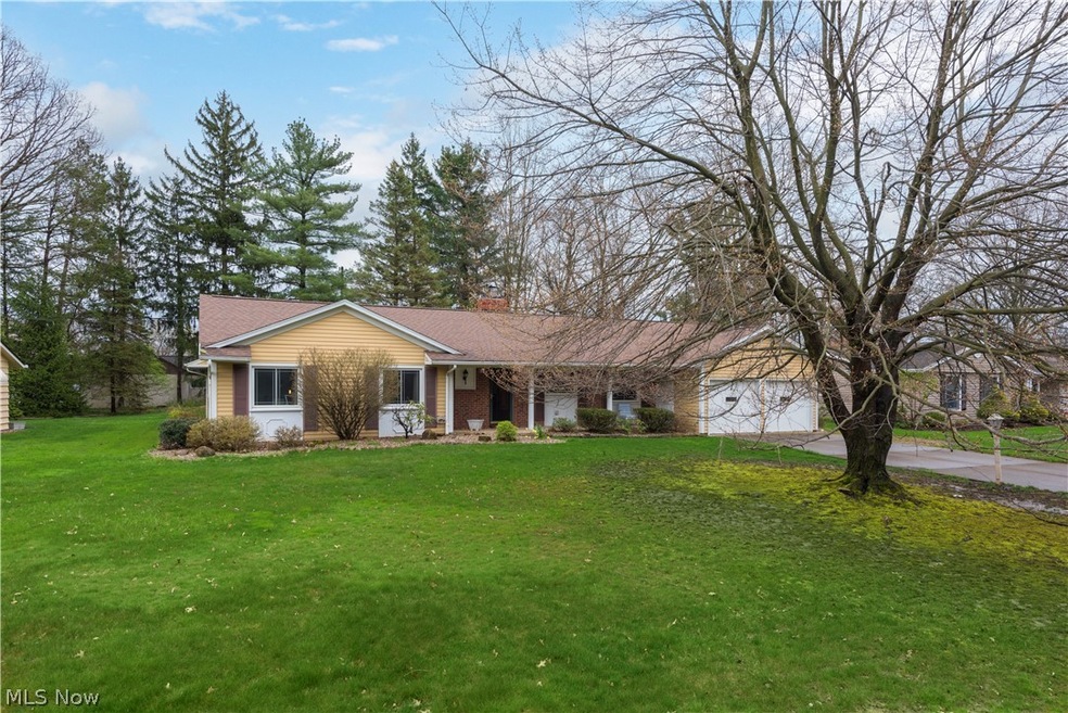 Ranch-style home with a front lawn