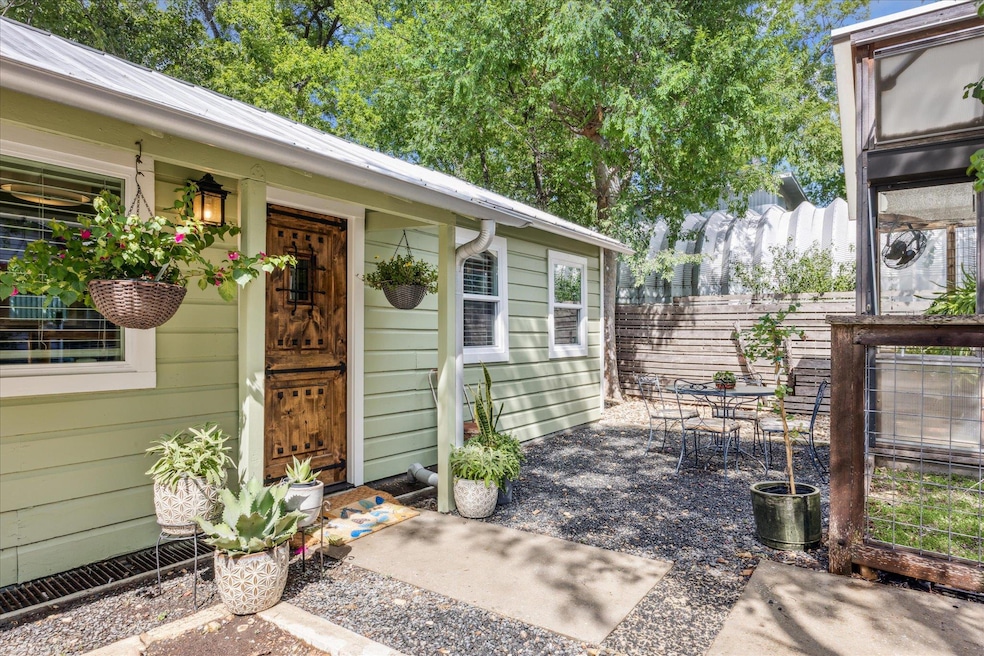 View of exterior entry featuring outdoor dining s