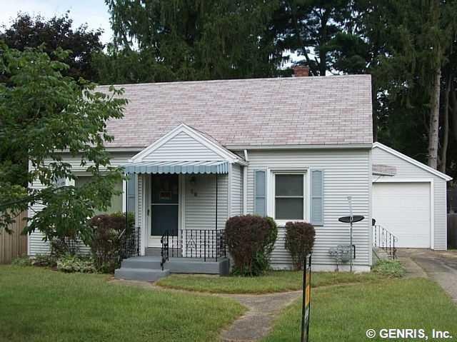 Exterior Front. Nicely treed lot.  Vinyl siding, r