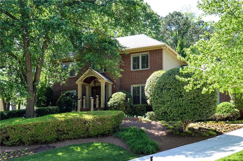 Stately brick front traditional is hiding a secret