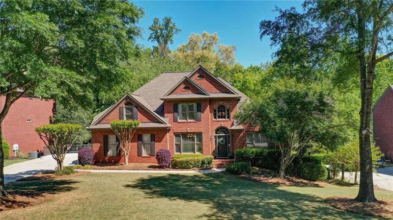 3 side brick home located on picturesque Grand Ave