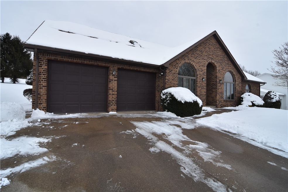 Concrete drive, two car garage with openers. Front entry flanked by Den/Study and Dining Room into open concept LR/Kitchen
