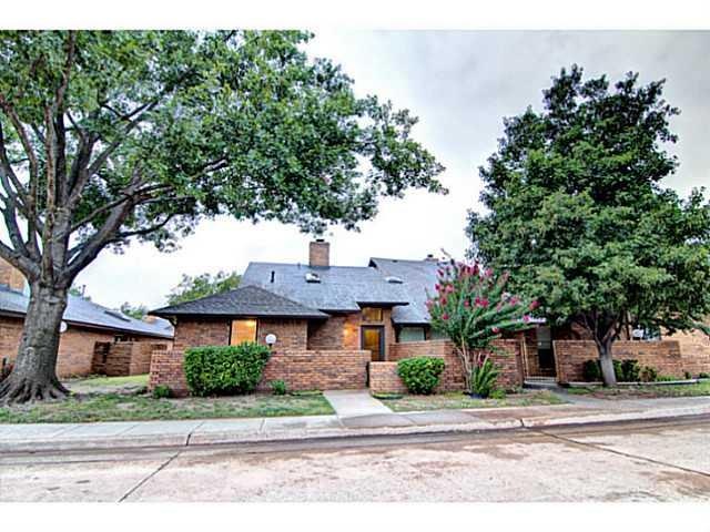 Exterior Front. Beautiful mature landscaping.