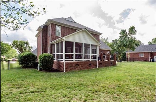Full brick home. Lovely screened porch and raised patio off the back of the house!