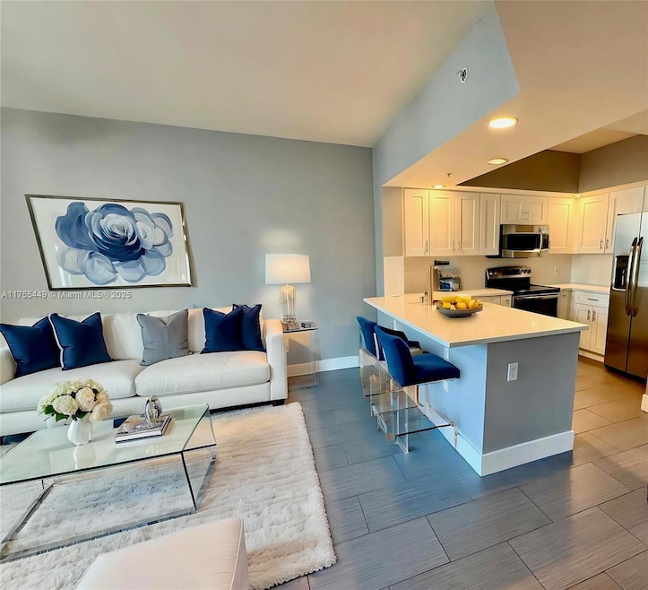 Fully Renovated Kitchen with Quartz Countertops and Stainless Steel Appliances