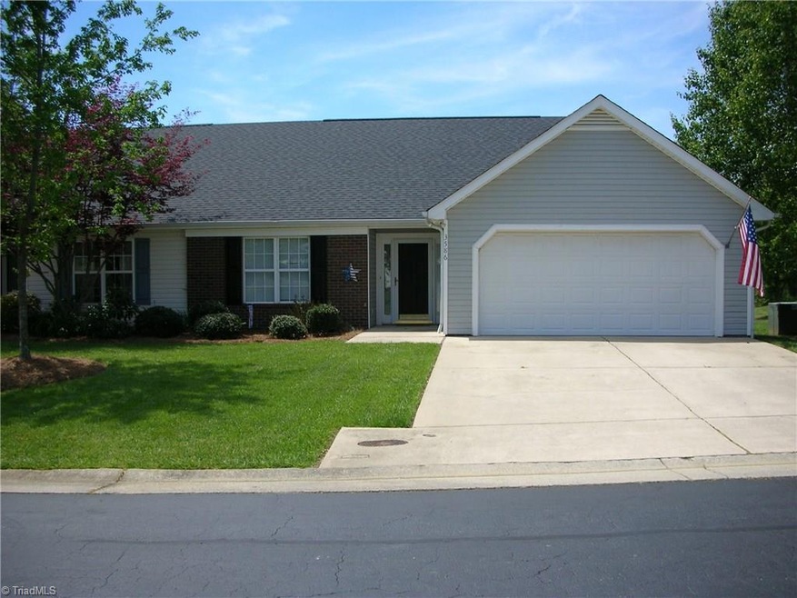 Front view of home with paved concrete driveway. Room for 2 cars. Nice landscaping and a great lawn.