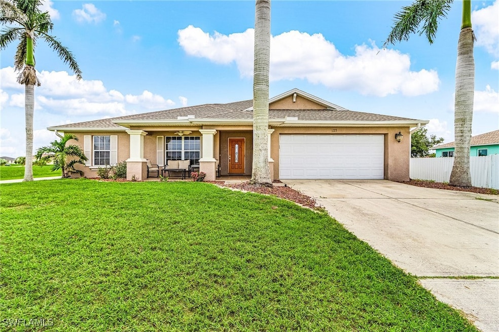 Single story home featuring stucco siding, an atta