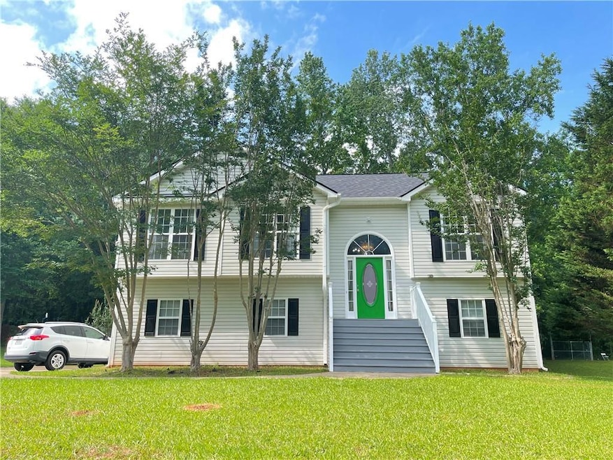Bi-level home with a front yard