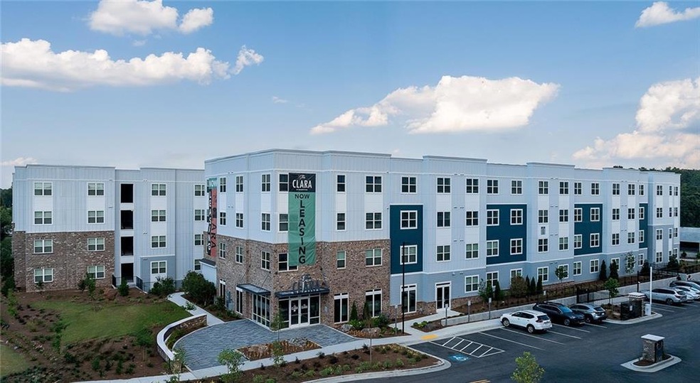 View of property with uncovered parking