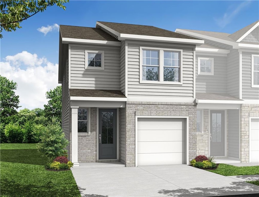 Craftsman-style home featuring driveway, an attached garage, roof with shingles, and a front yard