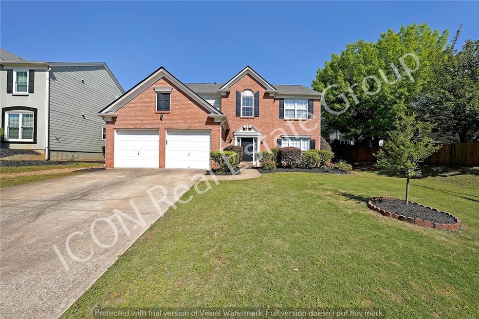 View of front of property with driveway, brick sid