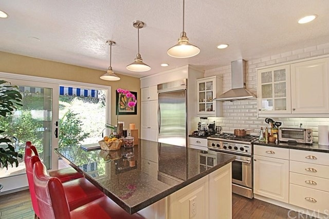 This beautiful chef's kitchen has all top of the l