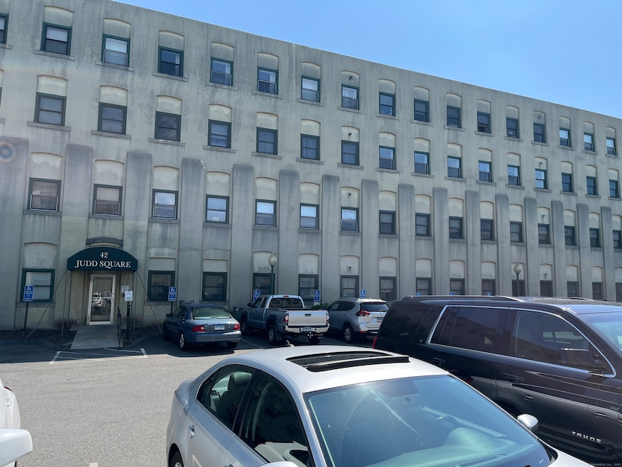 Main entrance to building 42 under awning. lockbox, mailboxes and doorbell located here, side entrance is much closer to this unit.